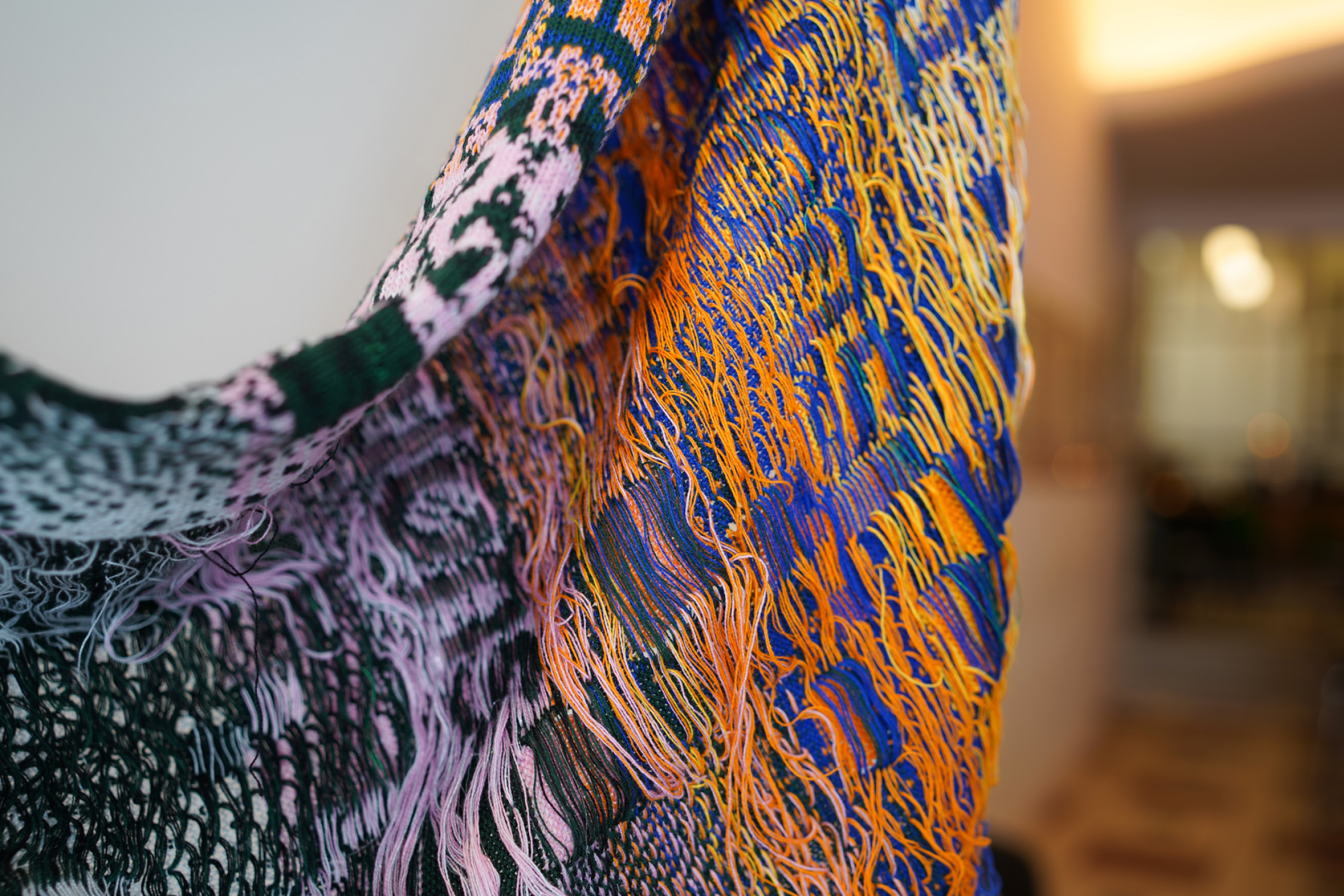 Installation of knitted posters exploring communication between humans and machines