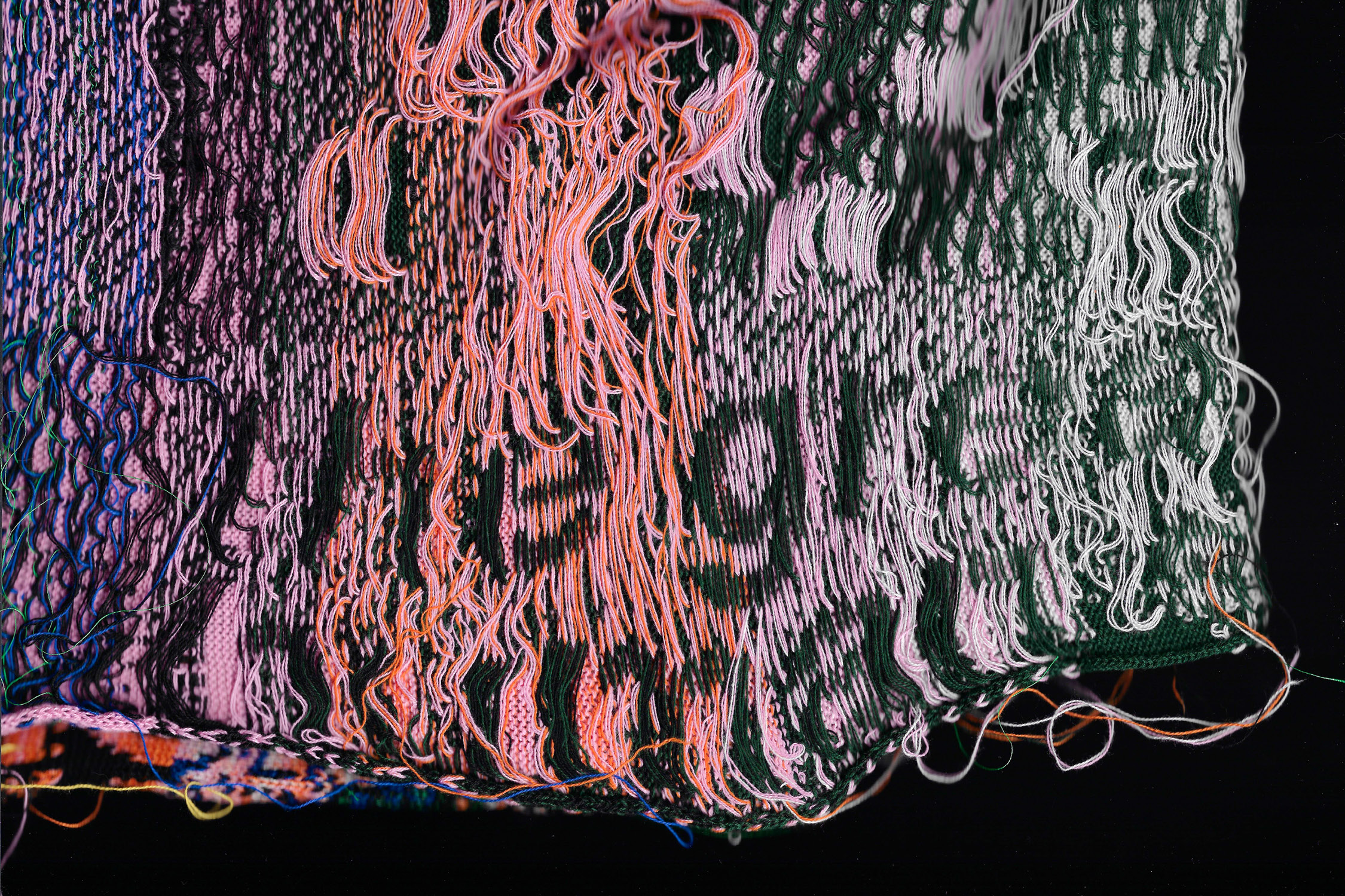 Installation of knitted posters exploring communication between humans and machines